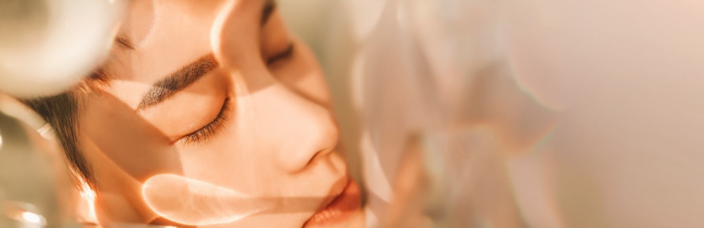 Relaxed face with soft golden light rays