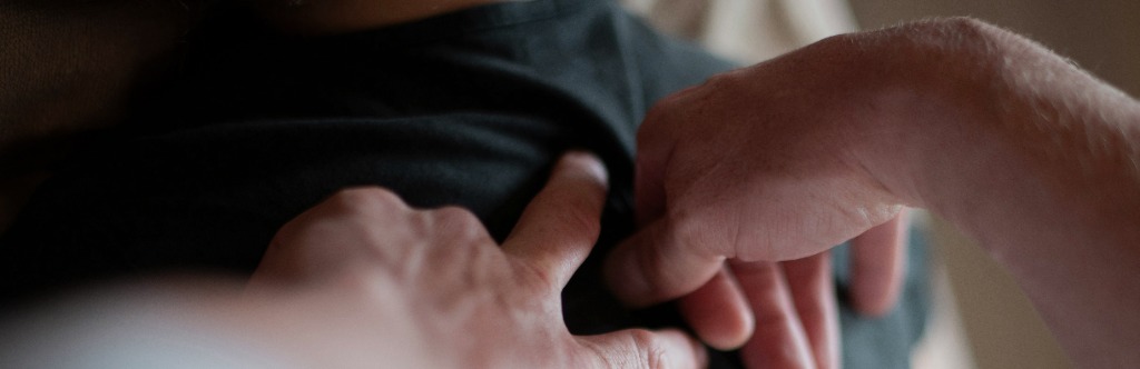 Massage therapy hands working on a shoulder